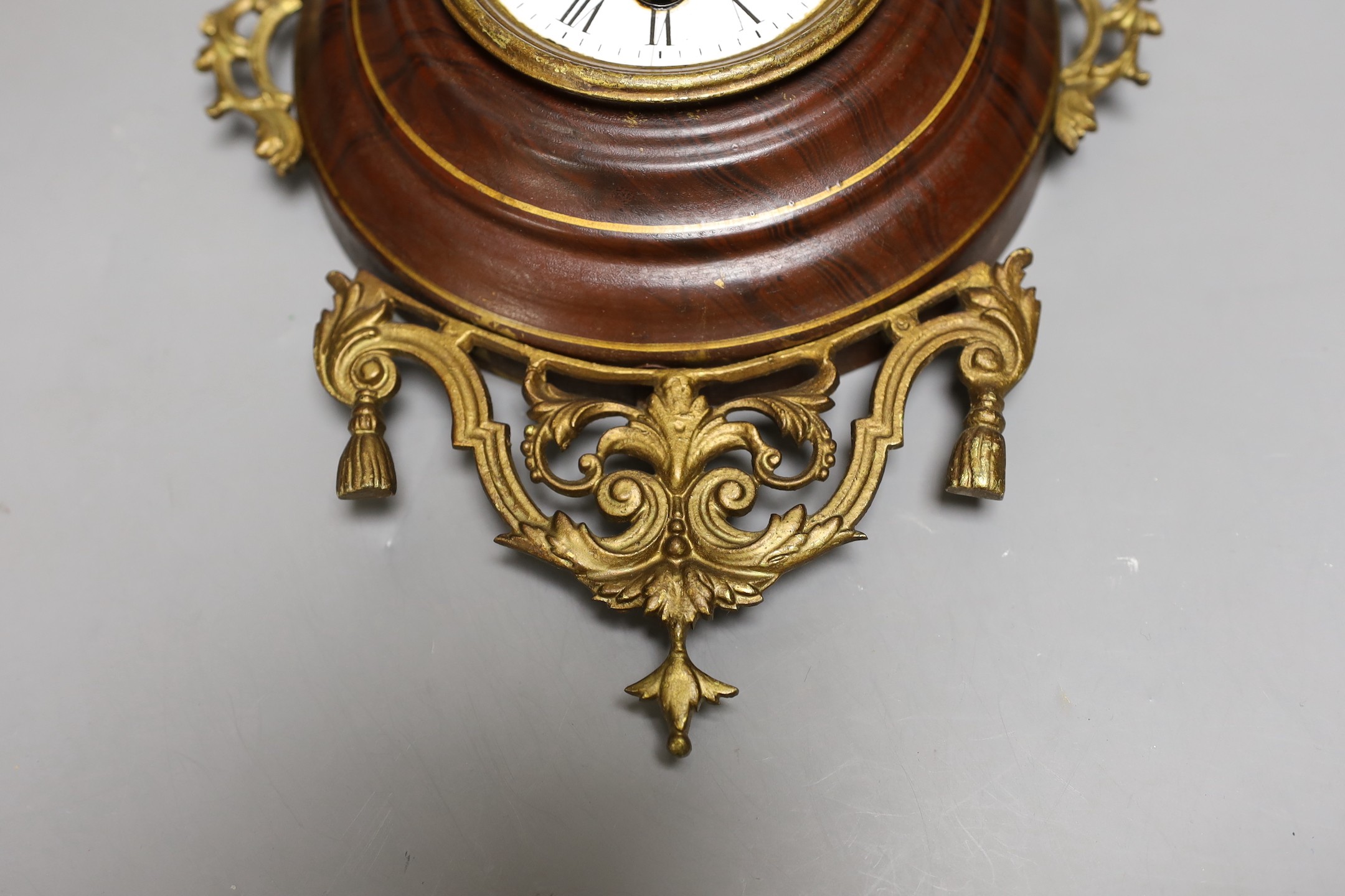 A French faux wood and gilt metal hanging wall clock, 35cm